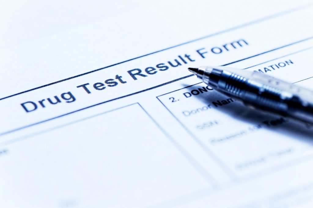 Drug test blank form with pen