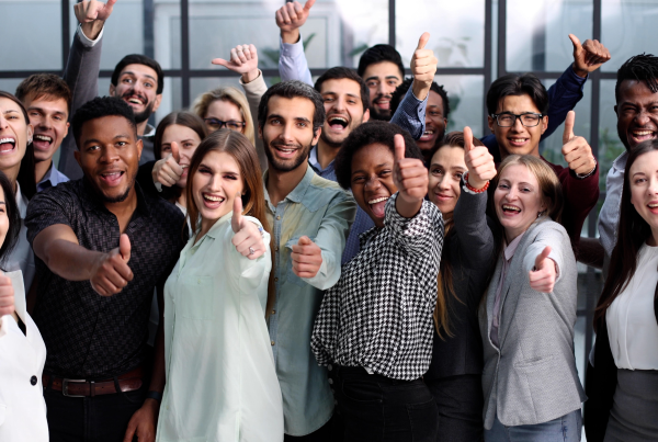 group of employees showing thumbs up
